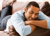Main thumb black man sleeping on couch